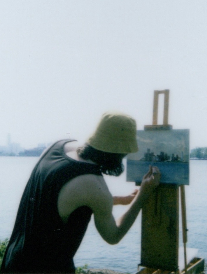 Julian David Kane painting en plein air by the water